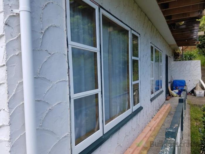 Wood siding over stucco